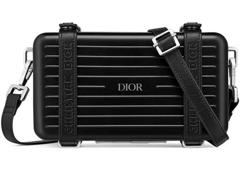 black dior and rimowa personal clutch|Dior clutch with hand strap.